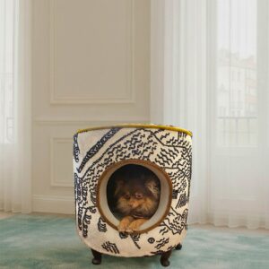 Dog in designer pet bed indoors