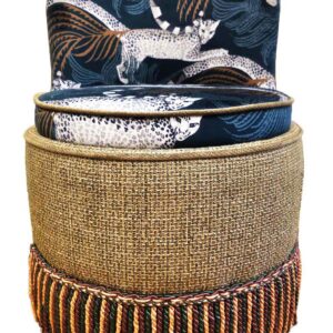 Decorative seat with animal pattern and tassel trim.