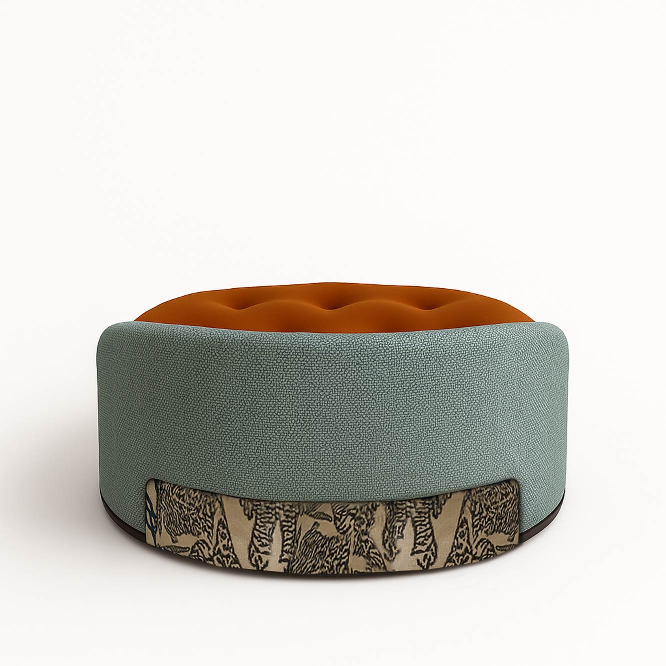 Round ottoman with textured fabric and patterned base.