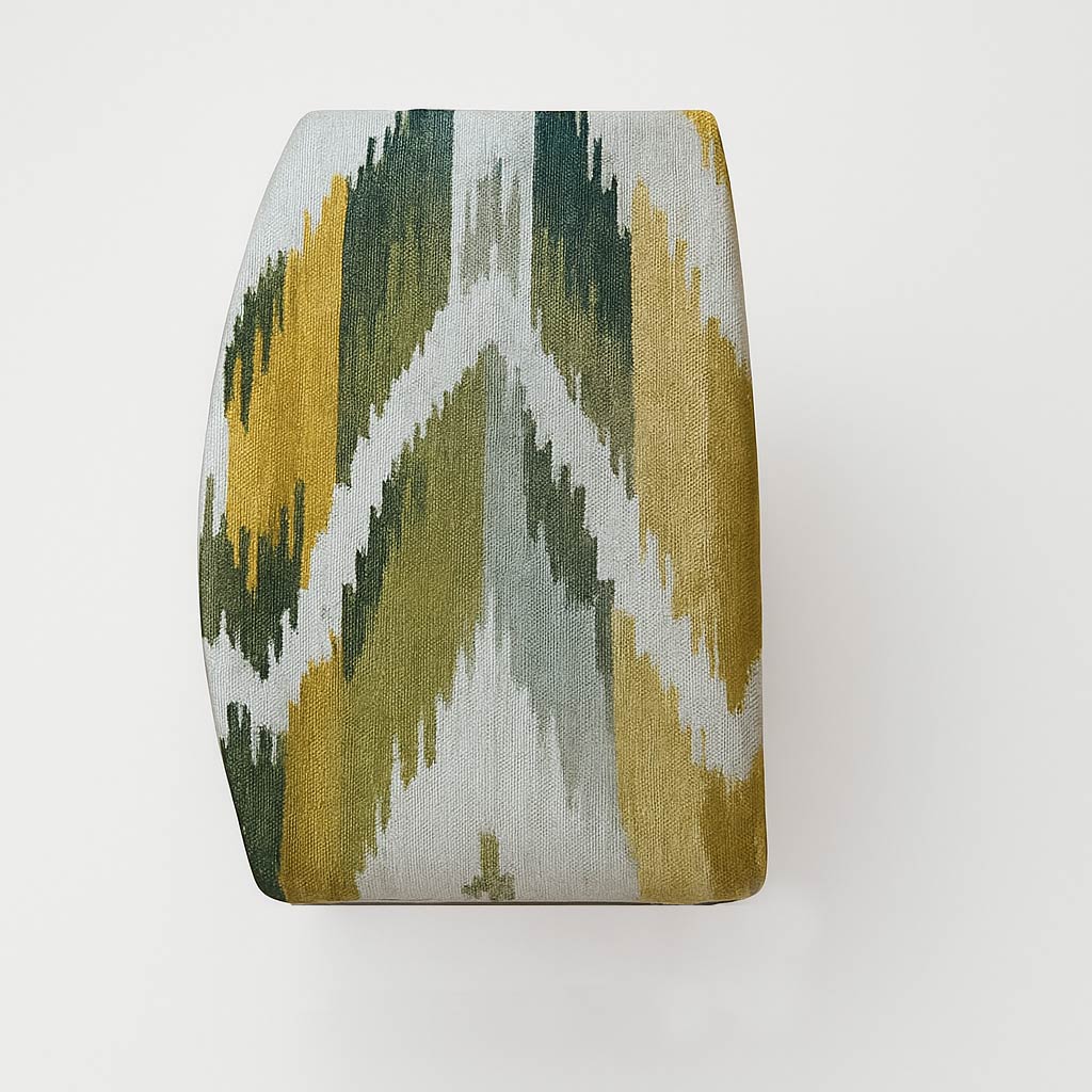 Upholstered stool with geometric fabric pattern.